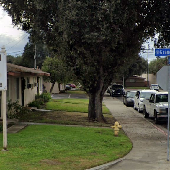 a sign for mountain breeze is in front of a house.