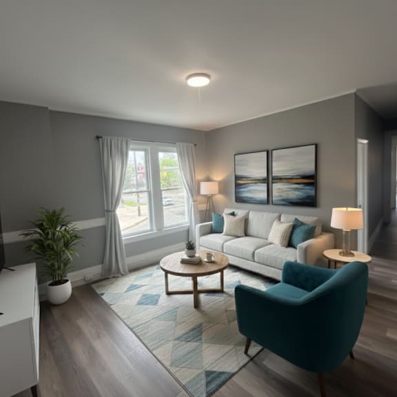 a modern living room with a flat screen tv and comfortable seating.