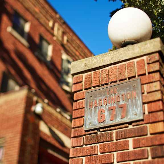 a brick pillar with a sign on it that reads the harrington 617