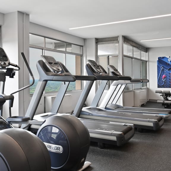a row of treadmills and other exercise equipment in a gym at CityView on Meridian, 3801 N. Meridian St, Indianapolis, IN 46208