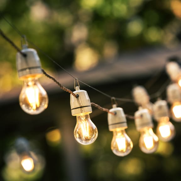 a string of light bulbs hanging from a wire  at Ellicott Grove, Ellicott City, MD 21043