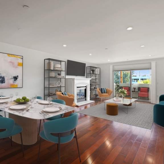 open-concept kitchen, dining, and living room space with patio