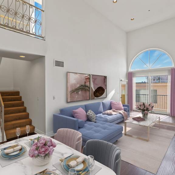 spacious living room with large-size windows, balcony, fireplace, and vinyl flooring