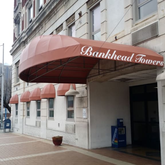 a red awning with bankhead towers written on it.
