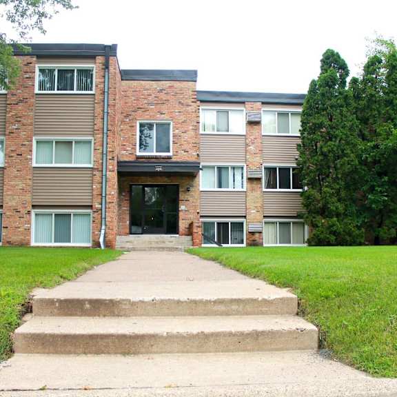 front view of brick exterior of 8920 wentworth apartments in bloomington, mn