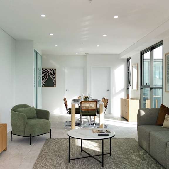 a modern living room with a flat screen tv and comfortable seating.