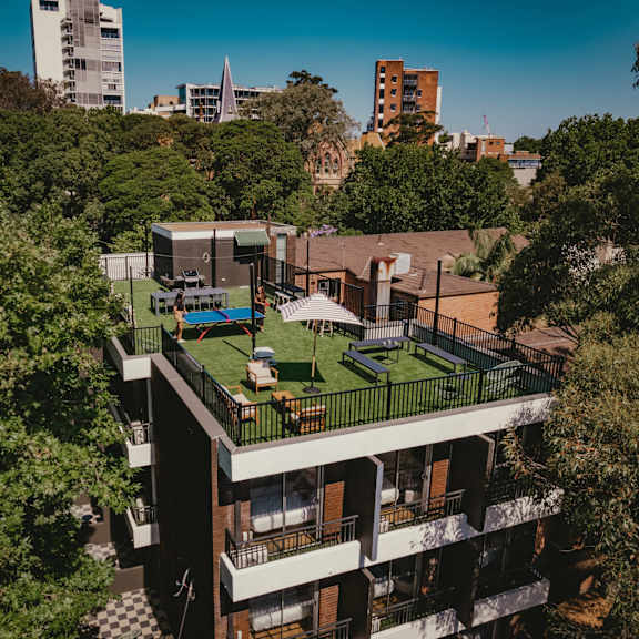 an aerial view of a building with a green roof