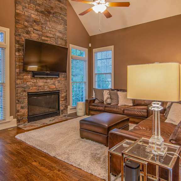 a living room with a fireplace and a couch.