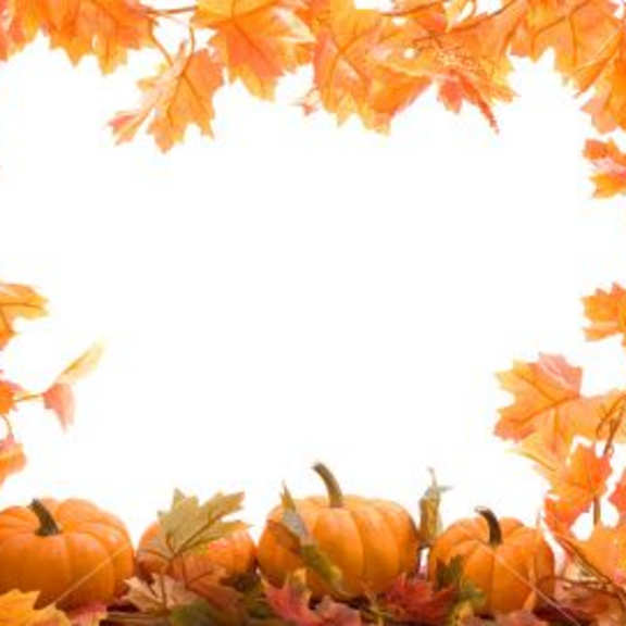 a frame of autumn leaves and pumpkins
