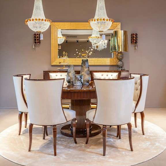 a dining room with a large table and chairs.
