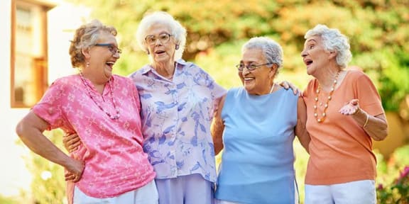 group of women laughing at Savannah Cottage of Lakeland, Florida