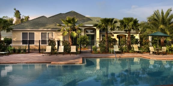 our apartments have a resort style pool with a pavilion and chairs