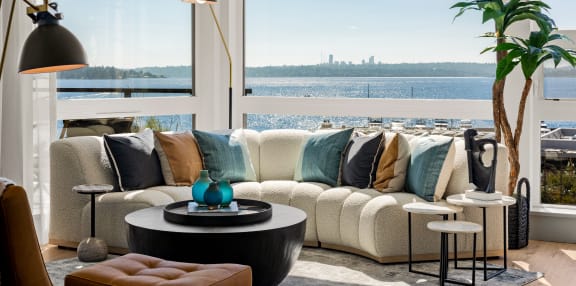 a living room filled with furniture and a large window