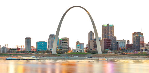 A city skyline with a large arch structure in the background.