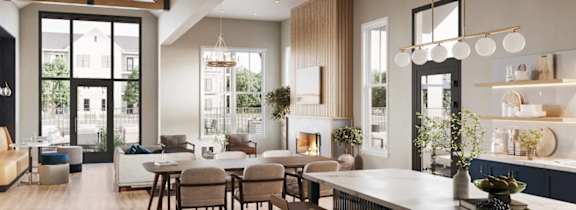 A modern open-concept living space with a kitchen, dining area, and a view of the backyard.