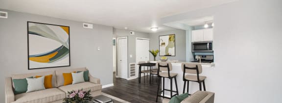 the living room of an apartment with a couch and a table