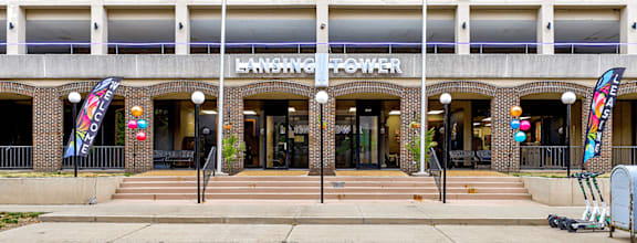 The front of a building with the name Lansing Power on it.