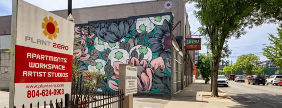 a mural of flowers on the side of a building