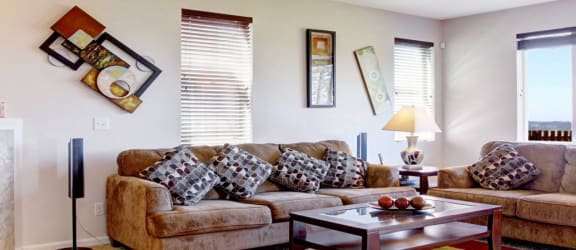 a living room with a couch and a fireplace