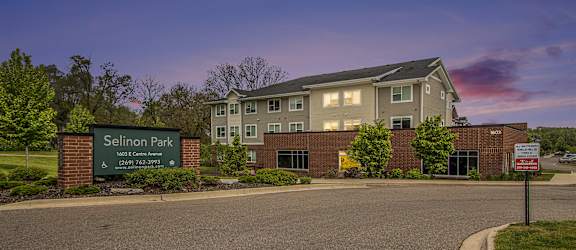 A building with a sign that says Selinon Park in front of it.