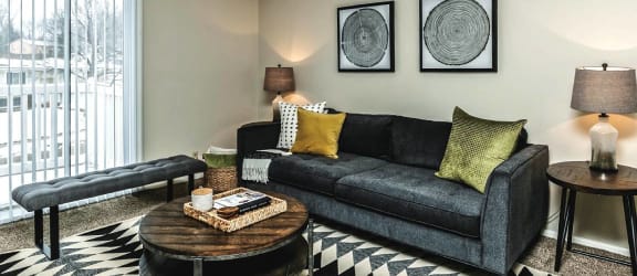 a living room with a couch and a table