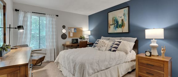 a blue wall with a clock on top of it