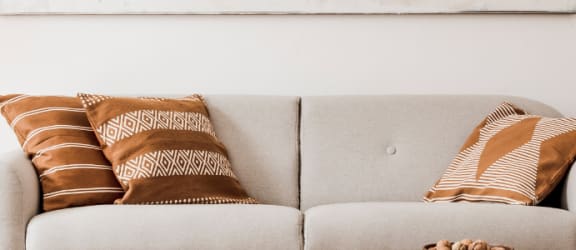 a living room with a couch and pillows