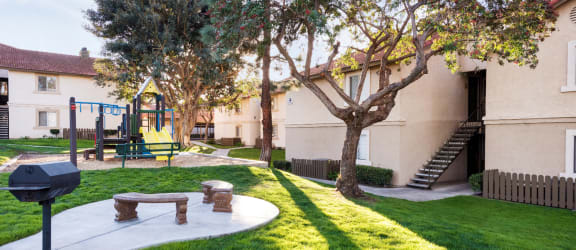 a playground at the whispering winds apartments in pearland, tx