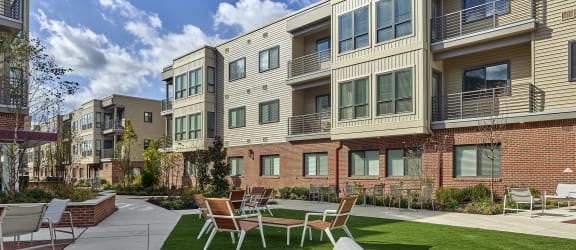 Lansdale Station Apartments banner including outdoor seating and balconies