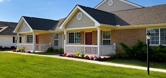 A house with a red door and white porch.
