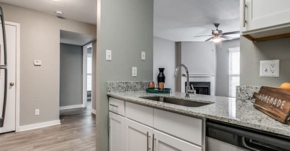 the kitchen and living room in a new home