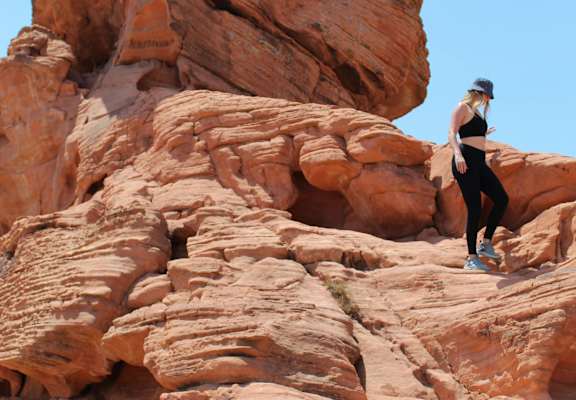 A person is climbing a rock formation.