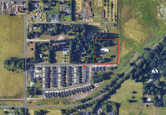 arial view of a building site with a red rectangle around it