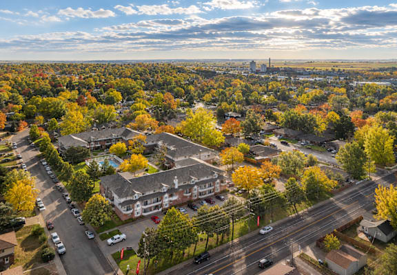 A view of a residential area with houses and trees.