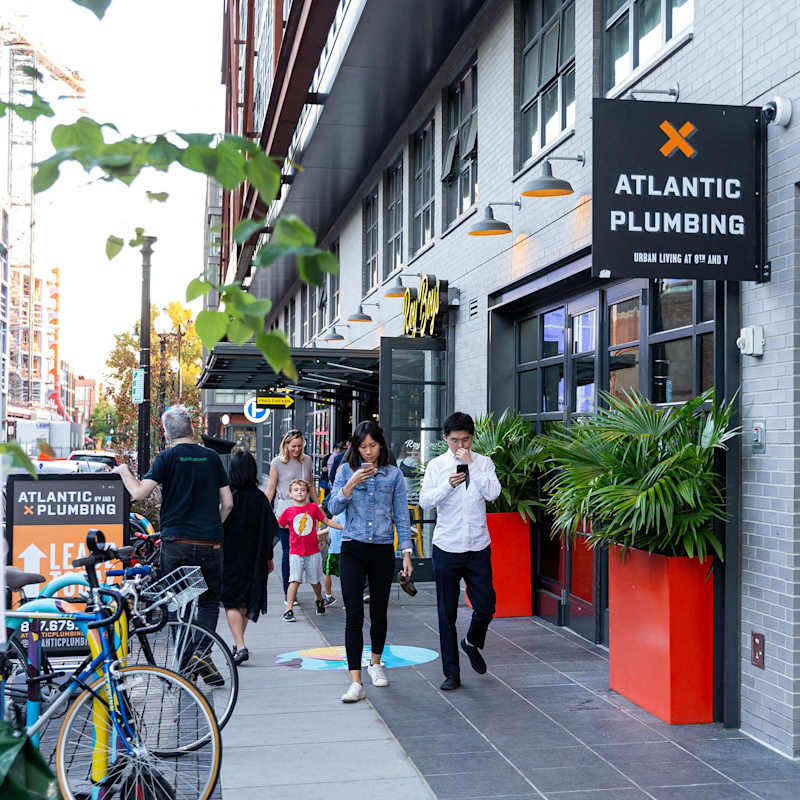 People walking the streets of Shaw, Washington, DC near Atlantic Plumbing