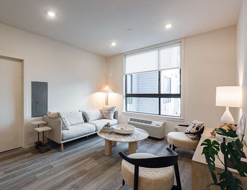 Living room with oversized windows in a residence at The Botanic