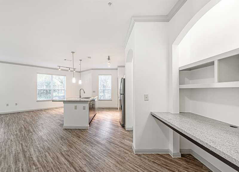 A kitchen counter beside the refrigerator