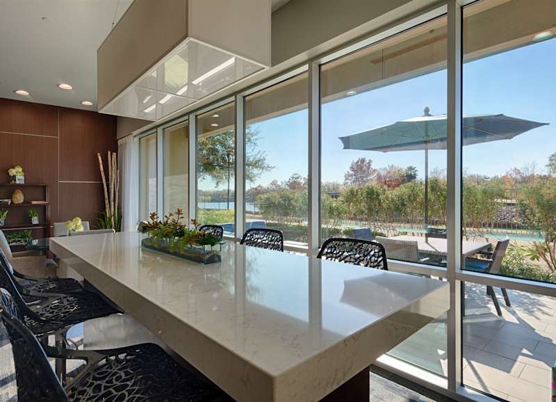 The lounge kitchen with a long counter and bar seating