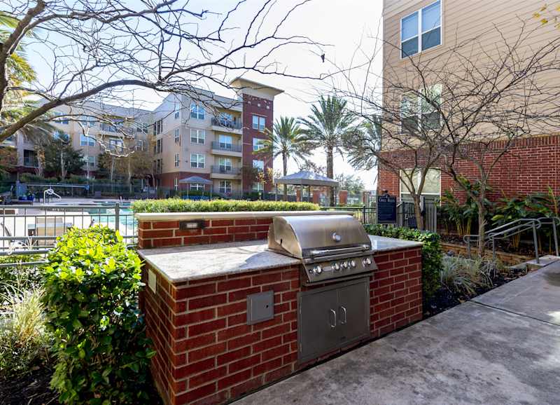 A brick barbecue grill station in the courtyard