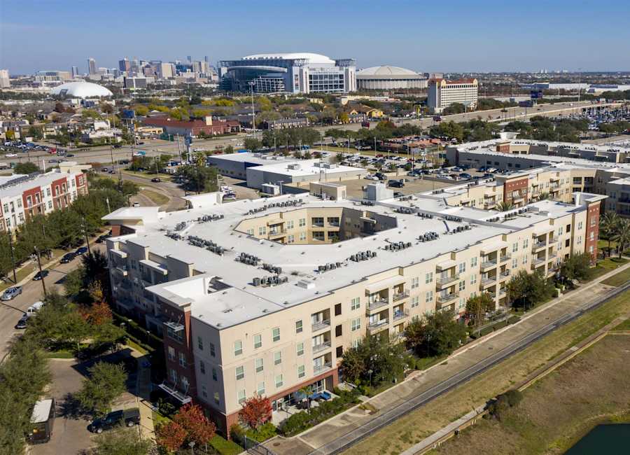 Aerial view of Regard at Med Center beside the lake, looking toward the Texas Medical Center