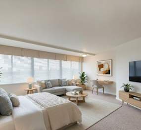 The 925 Apartments bedroom with bed, sofa and tv - Washington, DC