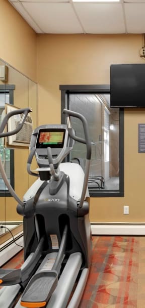 the gym has a treadmill and a tv at Hamline Terrace, Roseville, MN