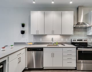 Kitchen with White Cabinetry and Stainless Steel Appliances