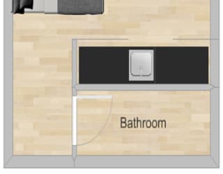 a floor plan of a bathroom with a stove and a door