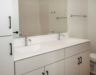 Renovated Bathrooms With Quartz Counters at The Hill Apartments, Saint Paul, MN, 55102