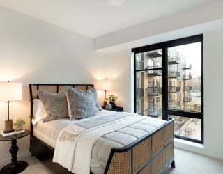 Master Bedroom With Large Window and View at The Hill Apartments, Minnesota