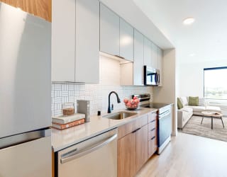 a kitchen with stainless steel appliances and a sink