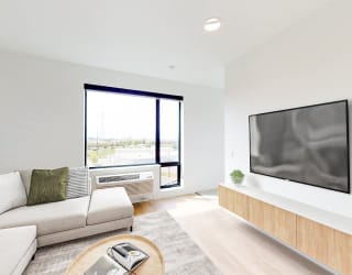 a living room with a couch and a tv