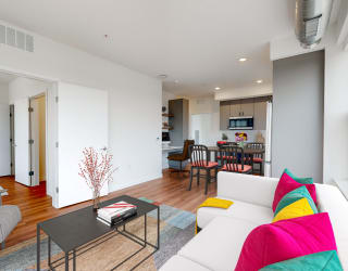 a living room with a couch and a table