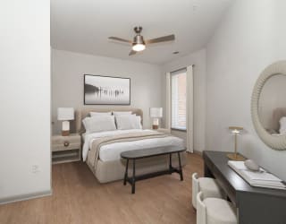 a bedroom with a bed and a ceiling fan at The Waterford At Rocketts Landing Apartments, PRG Real Estate, Richmond, Virginia